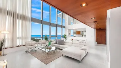 a living room with white furniture and large windows at Oceanview Private Townhouse at The Setai 1505-THB in Miami Beach