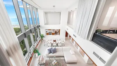 an open living room with white furniture and large windows at Oceanview Private Townhouse at The Setai 1505-THB in Miami Beach