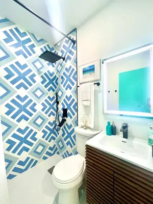 a bathroom with a toilet and a sink at SOBE MONARCH 2 - 2 Bedroom 2 Bathroom Apts - 2 Independent 1 bedrooms apts in Miami Beach
