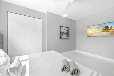 a bedroom with a bed with two dogs laying on it at Granada Modern Luxury in Massive Mansion with Heated Pool in Miami
