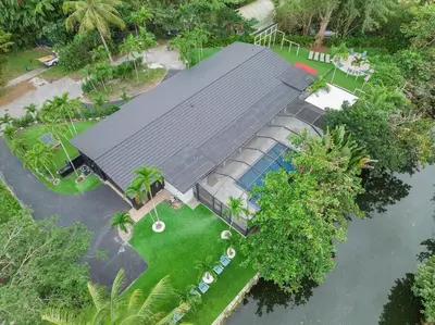 an overhead view of a house with a swimming pool at VillaKoBo Heated Pool Spa Bar Tennis Golf in Miami