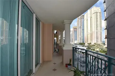 a balcony of a building with a view of a city at 3BR Condo in Sunny Isles Beach in Miami Beach