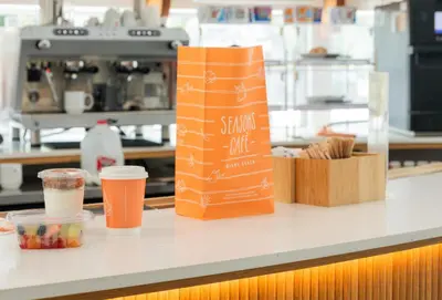 a counter with a bag and some cups on it at Kenmore Village Hotel, South Beach in Miami Beach