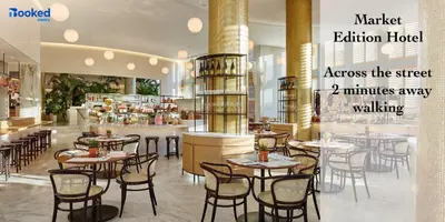 a restaurant with tables and chairs in a room at Newely remodeled apartment only 1 min to the beach! in Miami Beach