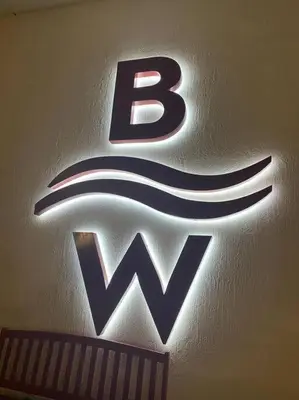 a close up of a sign with the letter b on a wall at Ocean Breeze & City Style, Miami Beach Luxury Stay -A in Hallandale Beach