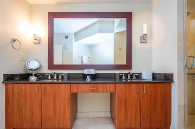 a bathroom with a sink and a large mirror at TRUMP INTERNATIONAL BEACH RESORT 2 BEDROOM APARTMENT 1600 Sqf Ocean and Bay View in Miami Beach