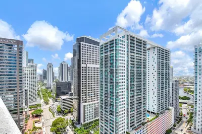 an aerial view of a city with tall buildings at Water front Icon Brickell, W Hotel building in Miami
