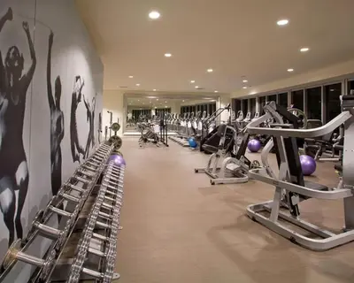 a gym with treadmills and elliptical machines at Water front Icon Brickell, W Hotel building in Miami