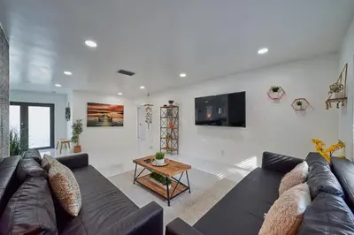 a living room with a couch and a table at Top Location Villa at Highland Lakes Blvd BY THE GLAMHOMES in Miami