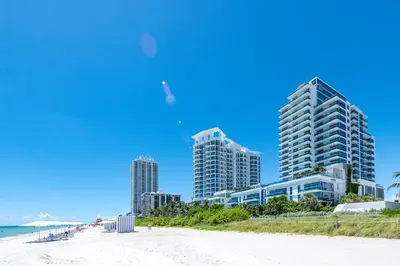 a view of a beach with tall buildings at Churchill Suites Monte Carlo Miami Beach in Miami Beach