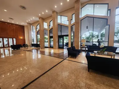 a lobby with couches and chairs in a building at Entire Beach Front Condo w/ pool Amazing view 4pax in Miami Beach