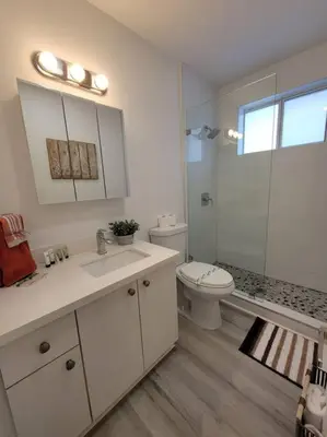 a bathroom with a toilet and a sink and a shower at Sol Miami #1 with free parking on premises in Miami