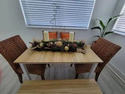 a wooden table with a christmas centerpiece on it at Sol Miami #1 with free parking on premises in Miami