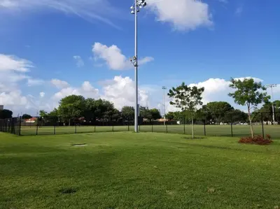 a park with a light pole in the middle of a field at My lovely home in Miami 15 minutes from the Beach in Miami