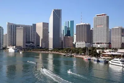 a river with boats in a city with buildings at My lovely home in Miami 15 minutes from the Beach in Miami