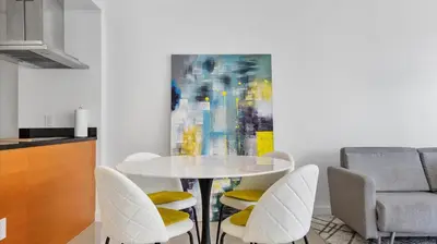 a dining room with a white table and chairs at Icon Brickell Stay, Pool, Spa, Views, Restaurants in Miami