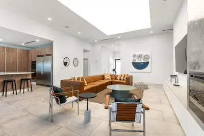 a living room with a couch and a table at Super Modern Waterfront Paradise Near the Beach in Miami