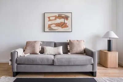 a grey couch in a living room with a lamp at Coral Gables 1br w pool wd nr shops airport MIA-74 in Miami