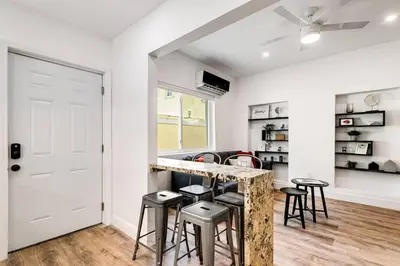 a kitchen with a counter and stools in a room at Beautiful Shenandoah One Bedroom Fast Internet Shen3 in Miami