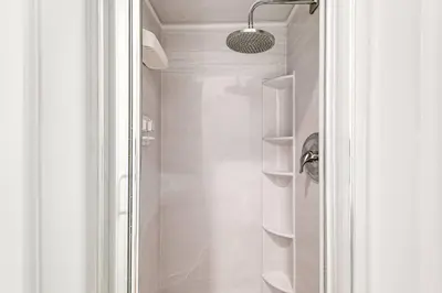 a bathroom with a shower with a glass door at Beautiful Shenandoah One Bedroom Fast Internet Shen3 in Miami