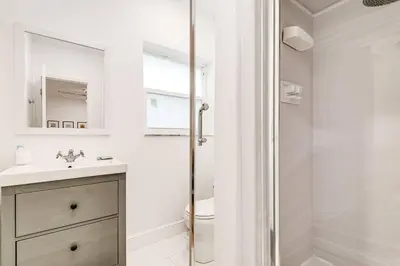 a white bathroom with a sink and a shower at Beautiful Shenandoah One Bedroom Fast Internet Shen3 in Miami