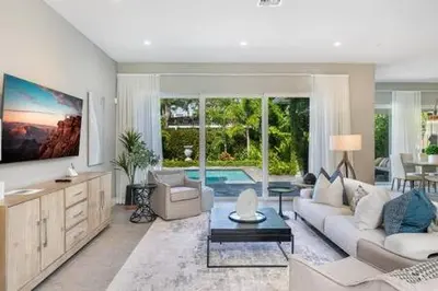a living room with a couch and a table at VILLA MAGNOLIA-with heated pool-by VIAC in Fort Lauderdale