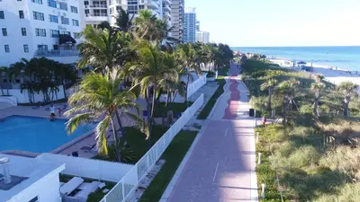 a view of the beach from the balcony of a resort at Deluxe Studios and Apartments at the Casablanca in Miami Beach