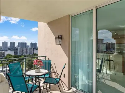 a balcony with a table and chairs on a balcony at King David By The Ocean in Miami Beach