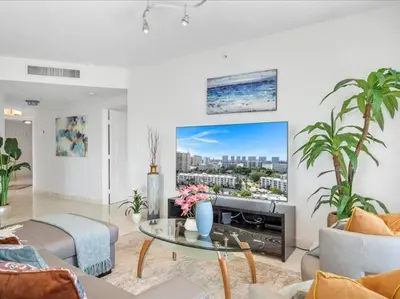 a living room with a couch and a table at King David By The Ocean in Miami Beach