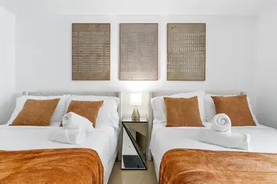 two beds sitting next to each other in a room at King David By The Ocean in Miami Beach
