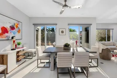 a dining room with a table and chairs at VILLA ST-BARTH Waterfront w htd pool by VIAC in Fort Lauderdale
