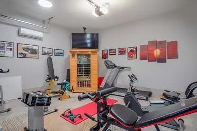 a gym with several exercise bikes in a room at VILLA ST-BARTH Waterfront w htd pool by VIAC in Fort Lauderdale