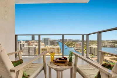 a balcony with a table and a view of the city at Awesome Bayview - Pools - Gym in Hollywood