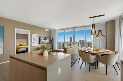 a kitchen and living room with a table and a dining room at Awesome Bayview - Pools - Gym in Hollywood