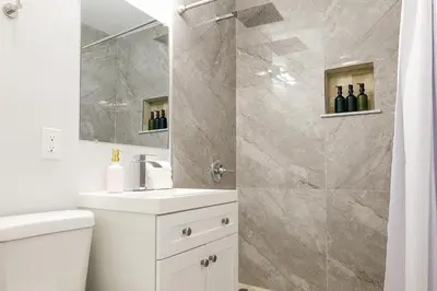 a bathroom with a sink and a shower with wine bottles at La Vie Boheme 1 - Relaxing Retreat w Parking in Miami