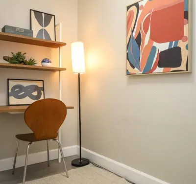 a room with a chair and a lamp at La Vie Boheme 2 - Charming Oasis w Parking in Miami