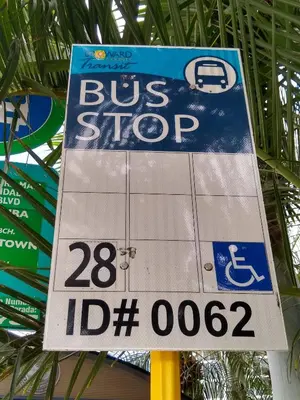 a bus stop sign on a bus stop at Estudios para 4 personas en la playa de Sunny Isles Beach in Miami Beach