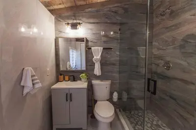 a bathroom with a toilet and a glass shower at Luxury Miami Village w/Pool+Grill+MiniGolf in Miami