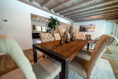 a dining room with a wooden table and chairs at Luxury Miami Village w/Pool+Grill+MiniGolf in Miami