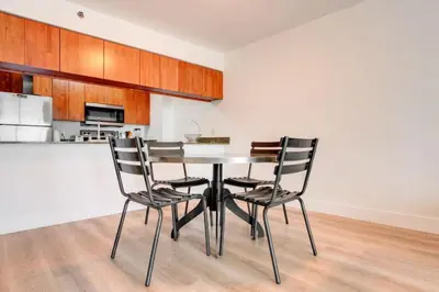 a dining room with a table and chairs in a kitchen at One of Brickell Bays Best with Pool and Gym Access in Miami