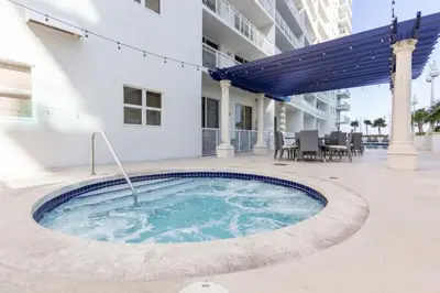 a hot tub in the courtyard of a building at One of Brickell Bays Best with Pool and Gym Access in Miami