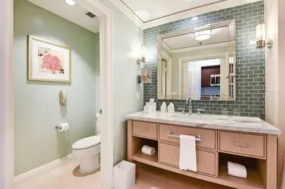 a bathroom with a sink and a toilet and a mirror at Stunning Studio Apartment Located at the Ritz Carlton-Key Biscayne in Miami
