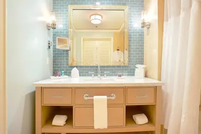 a bathroom with a sink and a mirror at Stunning Studio Apartment Located at the Ritz Carlton-Key Biscayne in Miami
