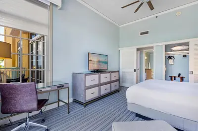 a bedroom with a bed and a desk and a television at Breathtaking 2 Bedroom Condo Placed at Ritz Carlton-Key Biscayne in Miami
