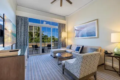 a living room with a couch and a tv at Breathtaking 2 Bedroom Condo Placed at Ritz Carlton-Key Biscayne in Miami