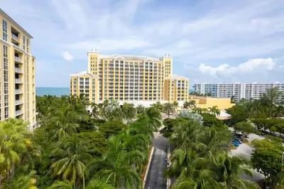 an aerial view of a resort with palm trees at The Palms, Ocean View Studio Located at Ritz Carlton - Key Biscayne in Miami