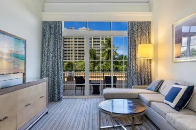a living room with a couch and a table at Unique 1BR Suite Condo Located at Ritz Carlton-Key Biscayne in Miami