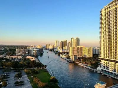 a view of a river in a city with tall buildings at Refined Oceanview Apartment, Kitchen, Comfort & Location -A in Hallandale Beach