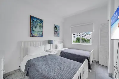 a bedroom with two beds and a window at Subtle 2 Bed in Edgewater near Downtown With Free Parking in Miami