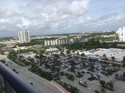 an aerial view of a parking lot in a city at Contemporary Beach Retreat, Sleek Design & Full Kitchen -A in Hallandale Beach